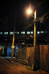 Dark Urban Alley at Night with Train