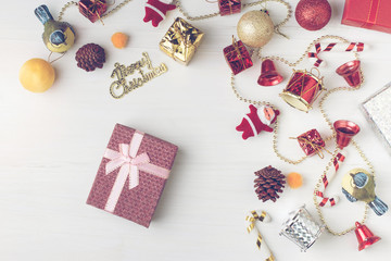 Christmas and Happy new year present box decoration flat lay on white wooden background with vintage filter.