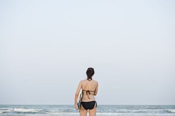 Fototapeta na wymiar Woman Beach Summer Holiday Vacation Surfing Concept