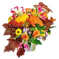 Autumn arrangement of flowers, vegetables and fruits isolated on white background. Closeup.