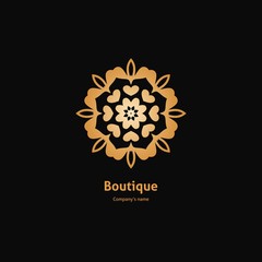 Luxury logotype in the shape of a flower for antique boutique. Gold logo, flower