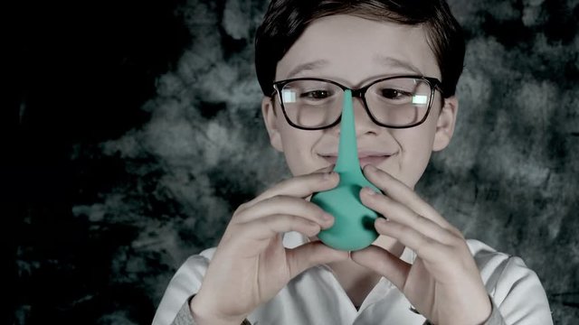 4k Science Shot of a Boy in Laboratory Holding a Clyster