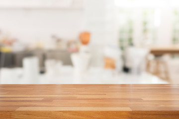 Fototapeta na wymiar Empty wooden table and white modern kitchen cafe background,rast