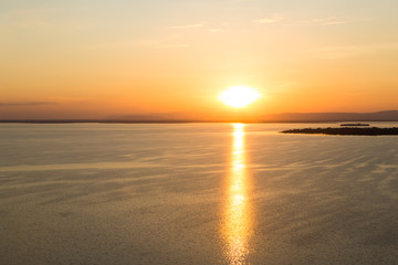 Fototapeta na wymiar Scenic view of beautiful sunset above the lake.Ubonrat dam khonk