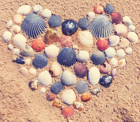 Heart made of seashells on the beach