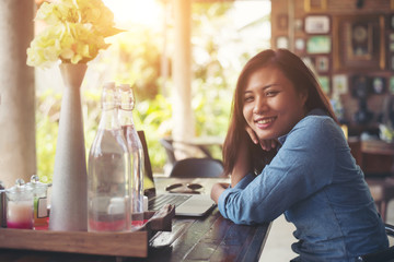 Young hipster woman with coffee and laptop. Portrait of beautifu