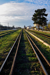 Fototapeta na wymiar old iron rails with green grass