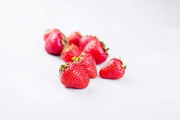 Fresh strawberry on gray background . Red strawberry. Loosely laid strawberries in different positions. Copyspace. 