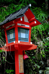 Fototapeta na wymiar Red light poles continued staircase entrance to Kibune-jinja shr