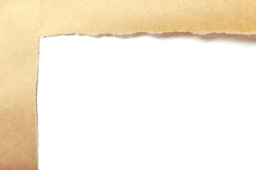 Brown package paper torn to reveal white panel