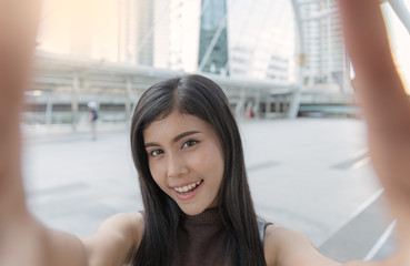 Asian Woman Selfie In City