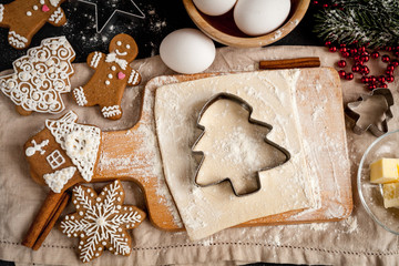 cooking christmas gingerbread on wooden background top view
