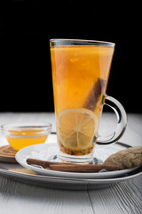 hot tea in glass on wood table