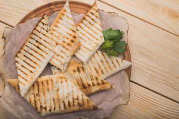 pita brean sliced on wood table