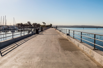 Fishing Pier at the Chula Vista Bayfront Park with marina and San Diego Bay.