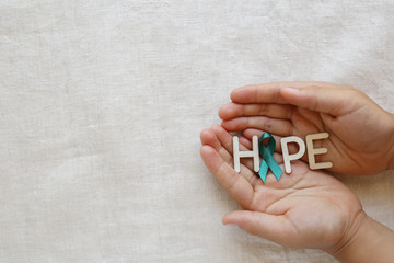 HOPE with Teal Ribbon on hands, Ovarian Cancer, cervical Cancer, Kidney Cancer awareness