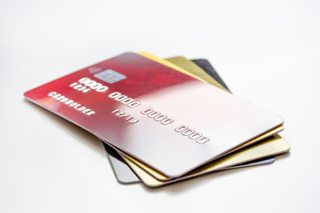 pile of credit cards on white background