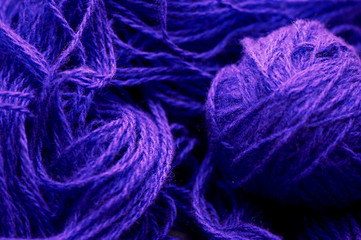 A tangle of blue wool on the background worko yarn.