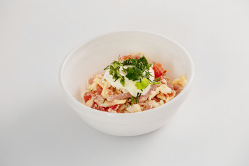 Bowl of salad with tomato, cheese and beef isolated 