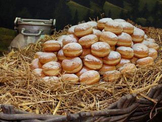 Heap of Sweet Bavarian Cream Filled Donuts on Bed of Straw