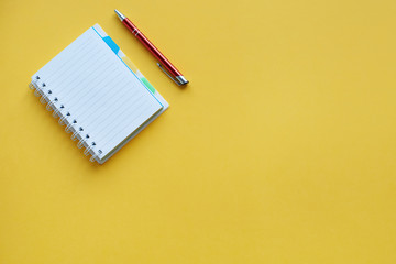 Pen lying next to open the notebook