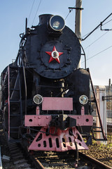 Fototapeta na wymiar Old restored steam train with wagons
