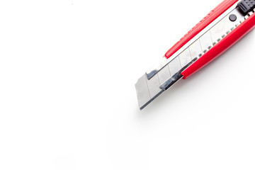 Obraz premium Red paper knife isolated on white background
