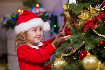 Little girl and christmas tree