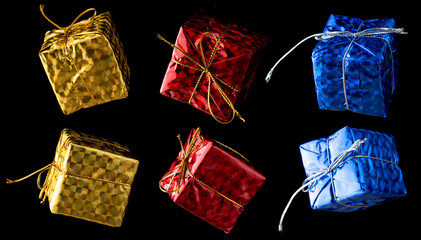 Gift box christmas ornaments isolated over black background