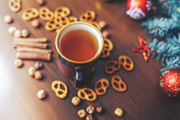 vintage Cup of hot tea with crackers on wooden background decorated 