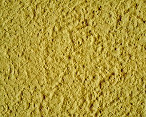 rough yellow plaster closeup