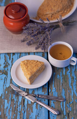 Honey cake on a wooden background