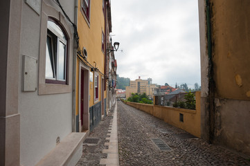 Fototapeta na wymiar 旅、Portugal,Coimbra / Portugal Coimbra の路地風景、狭い一方通行の道が多い。
