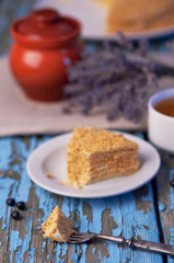 Honey cake on a wooden background
