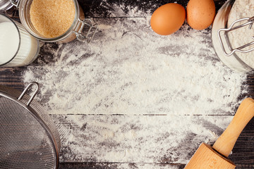 Baking background. Baking ingredients on the wooden table