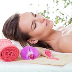 Obraz na płótnie Canvas Beautiful woman relaxing after massage in spa salon