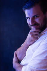 Portrait of a bearded man light  by fluorescent light. Bearded m