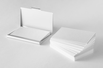 Mockup of blank business cards stack and cardholder