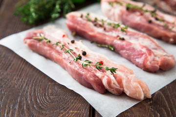 Raw meat. Pork ribs with herbs and spices