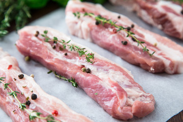 Raw meat. Pork ribs with herbs and spices