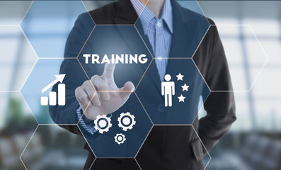Businessman hand pressing button training. sign on virtual screen. business concept.