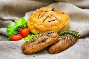 Fresh bread and vegetables  on textiles