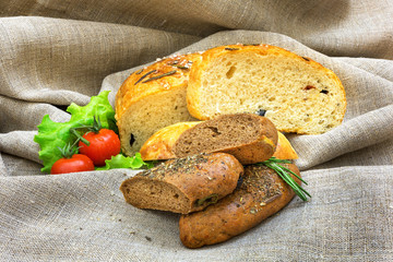 Fresh bread and vegetables  on textiles
