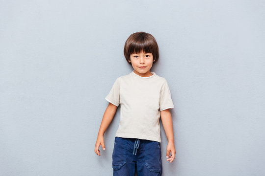 Portrait of cute little boy standing