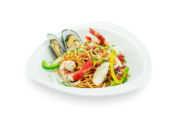 Spaghetti with seafood in white plate isolated