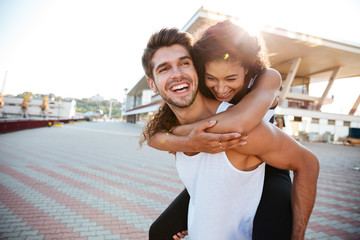 Couple having fun and laughing together outdoors