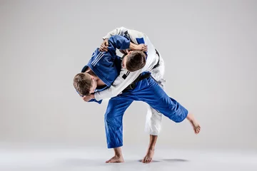 Fototapeten The two judokas fighters fighting men © master1305