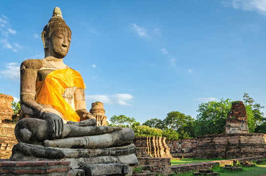 Ayutthaya (Thailand), giant Buddha statue in an old temple ruins