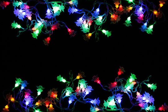 christmas lights border on black background