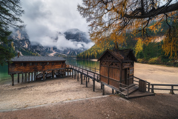 Fototapeta na wymiar Italy. Dolomites. Boat station on the Braies Lake